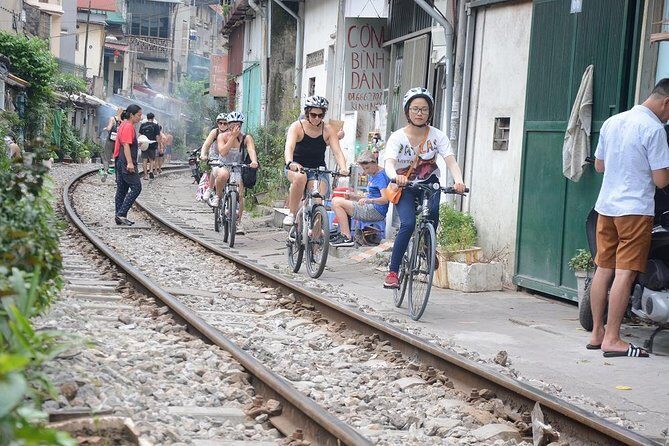 Bicycle Tours Hanoi: Half Day Hanoi City Bicycle Tours - Long Biên Bridge crossing: a river view with good timing