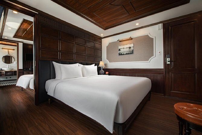 Doris Cruise 5 star cruise 3 days visiting Halong - Lan Ha Bay - Day 3 sunrise Taichi and Dark & Bright Cave: the morning segment with atmosphere