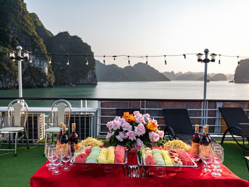 From Hanoi: 2-Day Ninh Binh Tour with Ha Long Bay Cruise - Day 2: Ha Long Bay caves, Titop Island swim, and a sunset party