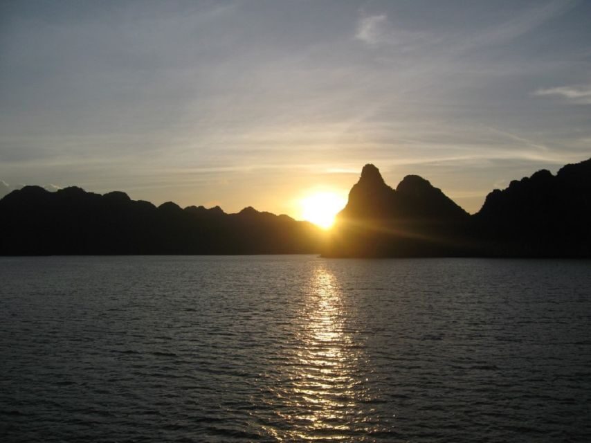 From Hanoi: Ha Long - Bai Tu Long Bay 2-Day 1-Night Cruise - Day 1: Cap La kayaking, a sunset party, and night views with a cocktail