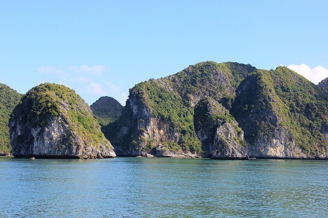 Full day boat trip with Cat Ba Captain Jack to Lan Ha Bay and Ha Long Bay - Lan Ha Bay stop: kayak through rock-arch tunnels and Dark–Bright Cave