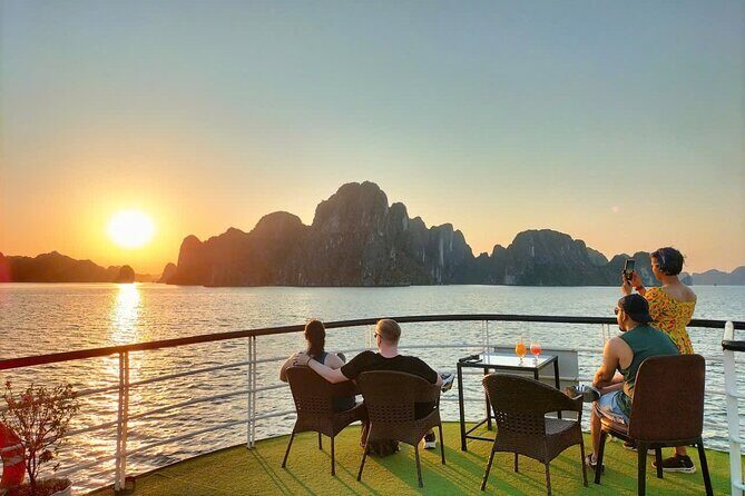 Ha Long Bay Cruise Day Tour - Cave, Kayaking, Swimming & Lunch - Hang Luon Cave: kayaking through calm water under limestone cliffs