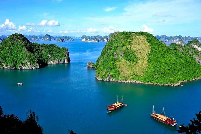 Halong Bay Day Tour With Titop Island, Cave, Kayak & Lunch - Tuan Chau Boarding and the Seafood Lunch That Keeps the Day Moving