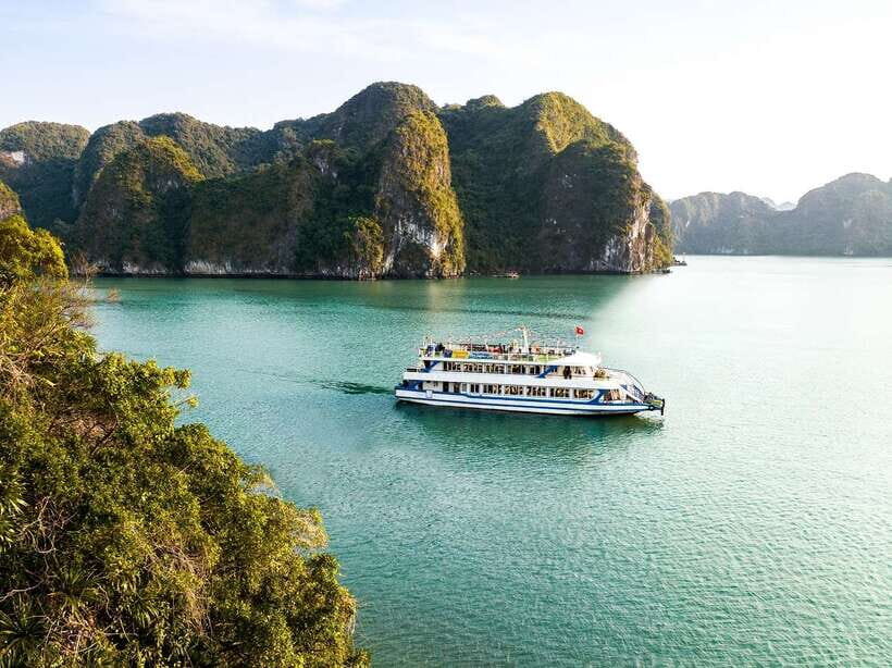 Hanoi: Ha Long Bay Day Cruise - Swimming, Meal, Kayaking - From Hanoi to Tuan Chau: pickup, the 2.5-hour ride, and a quick pearl stop
