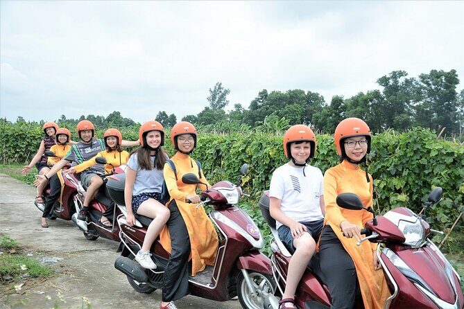 Hanoi Motorbike Tour Led By Women: Hanoi City Half Day - Huu Tiep Lake, Cho Gioi Market, and the Downed B-52