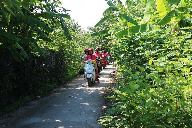 Hanoi Vespa Countryside Tour With Female Ao Dai Riders Half Day - Pagoda and temple stop: a rare ancient timestamp