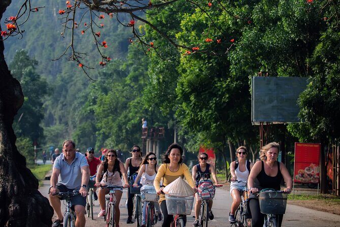 Ninh Binh Full Day Tour with Hoa Lu, Trang An and Mua Cave - Trang An grottoes by boat: caves, limestone, and shared-time reality