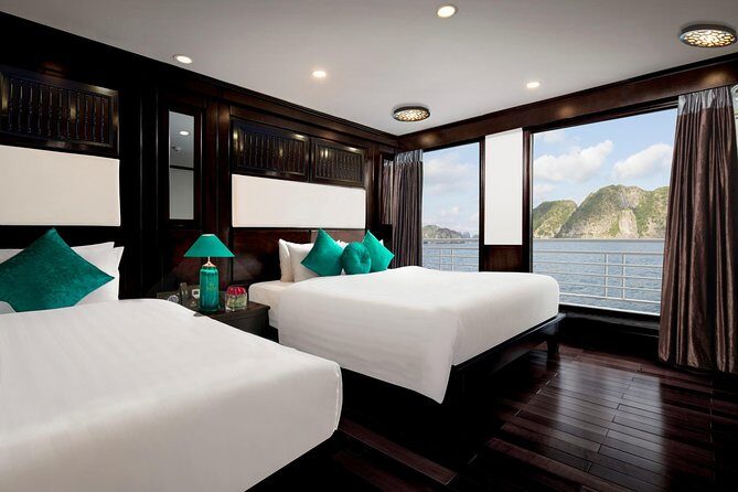 Overnight Luxury 5 Star Alisa Cruise with Meals, Kayak or Bamboo Boat - Day 2: tai chi, breakfast with a bay view, and Sung Sot Cave