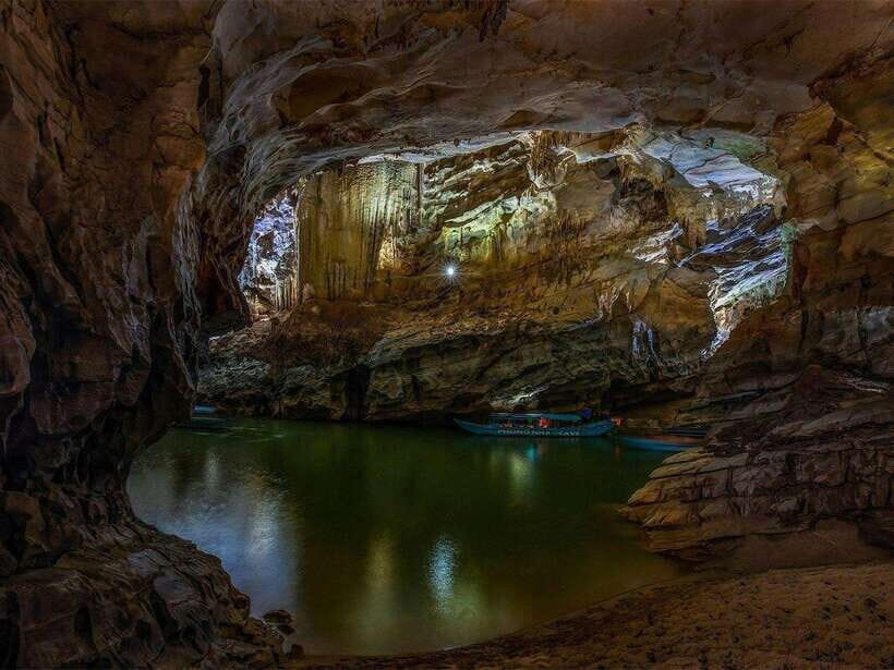Phong Nha/Dong Hoi: Phong Nha Cave and Paradise Cave Tour - Entering Phong Nha Cave: guided steps plus a boat-to-foot approach