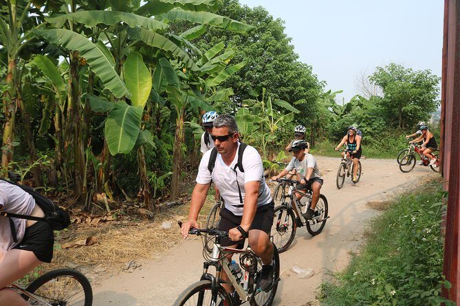 Red River island backroad, Rural Countyside Area and Train Street - West Lake cycling views and the Thang Long citadel gate moment